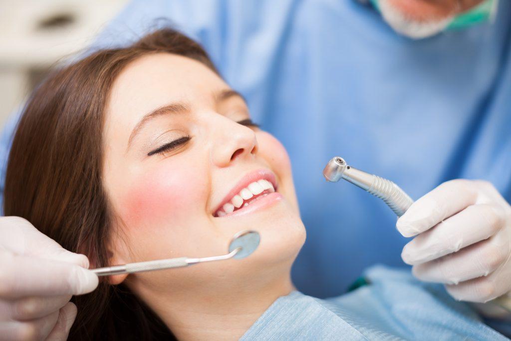 woman-receiving-dental-treatment-scaled