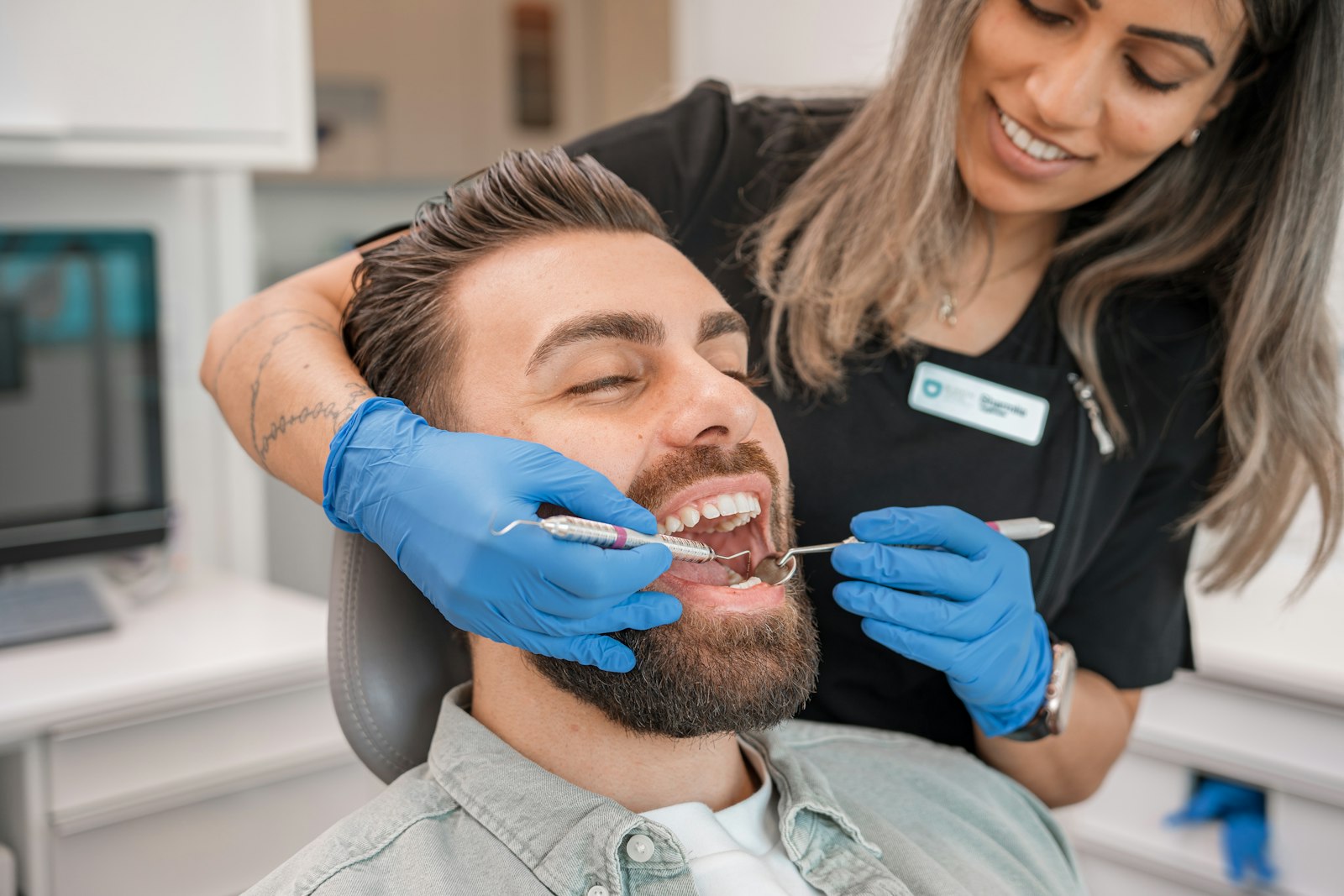 Dentist examining a patient for early signs of gum disease