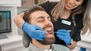 Emergency dentist in Indianapolis examining a patient with tooth pain