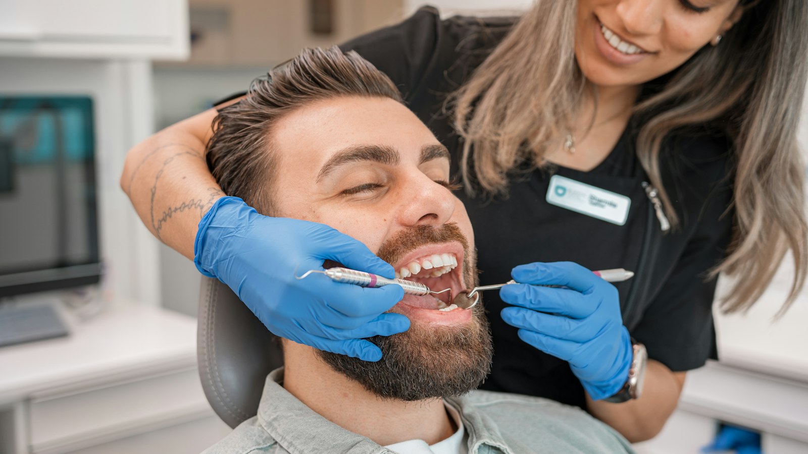 Emergency dentist in Indianapolis examining a patient with tooth pain