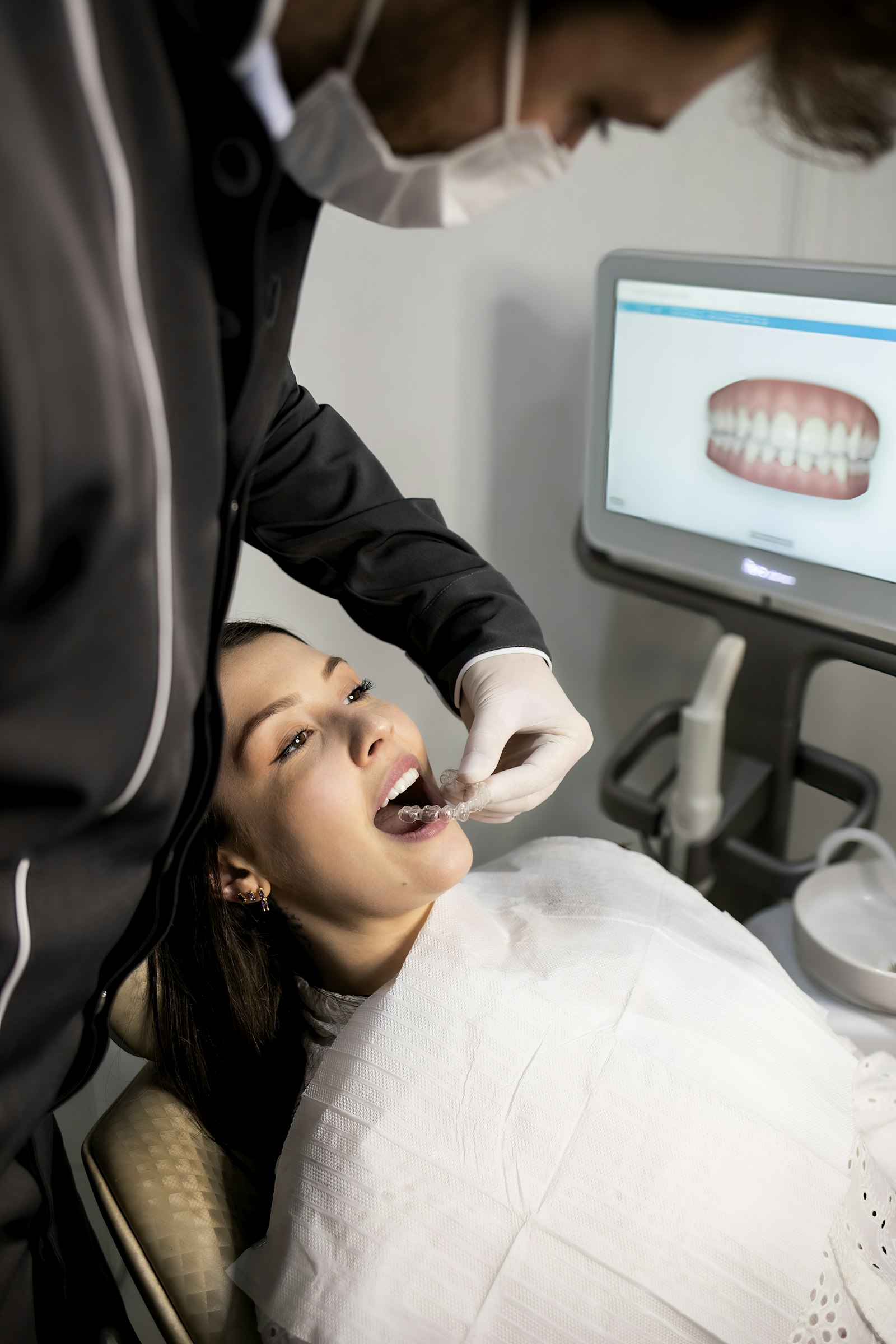 Dentist scanning a patient's teeth to show how long dental crowns last