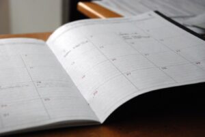 Open planner reminding patients to use dental benefits before year end